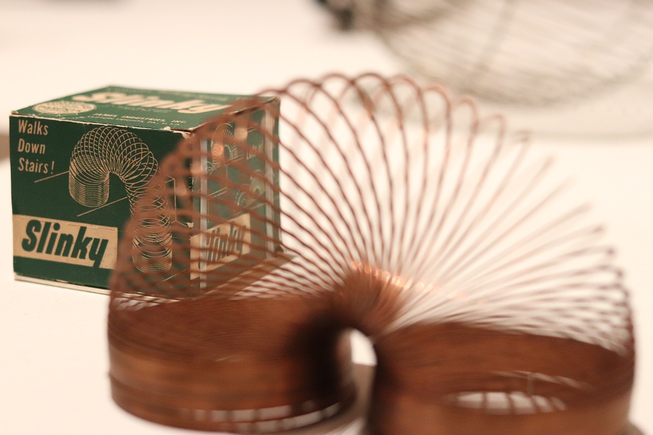 Slinky in front of its box
