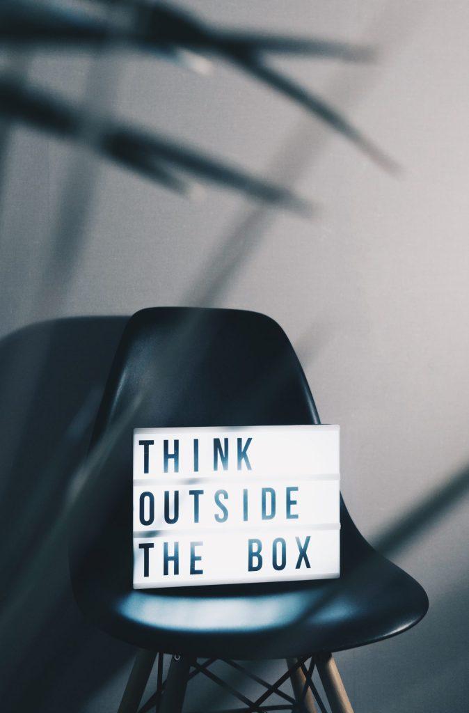 Lightbox on a chair that says "Think Outside the Box"