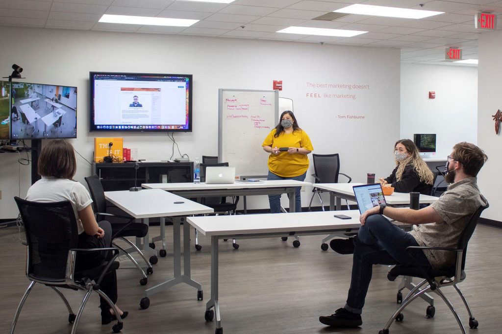 Monique leading team meeting