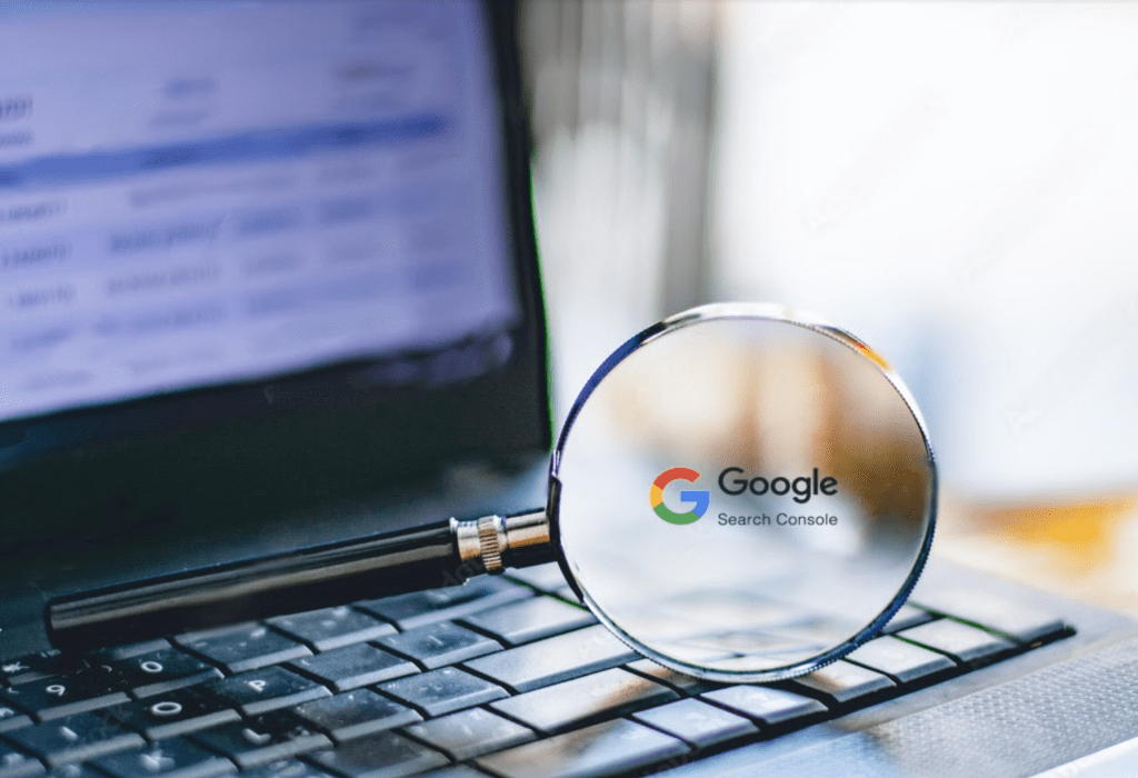 Google search console graphic on magnifying glass sitting on a laptop